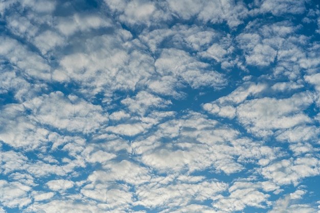 White clouds on a blue sky background. Nature concept