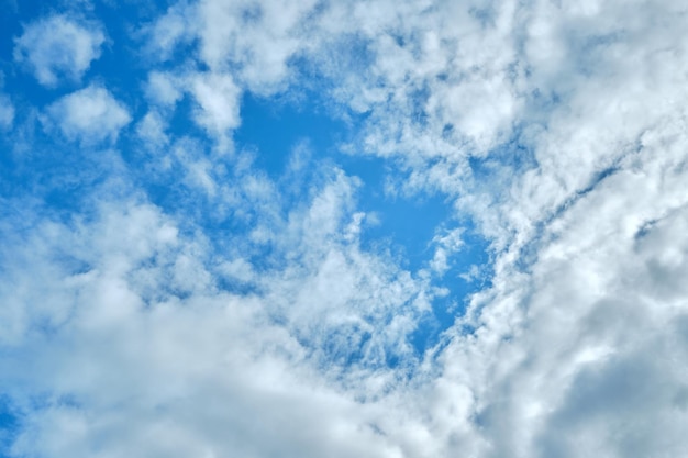 White clouds on a blue sky background