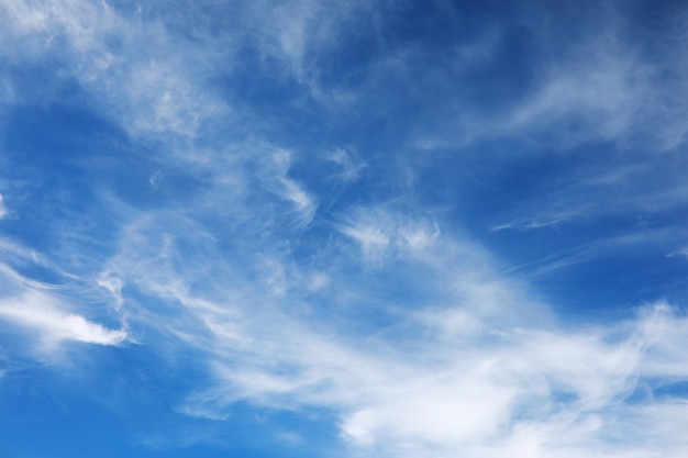 White clouds in the blue sky at noon summer