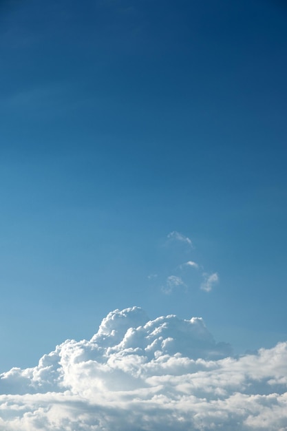 White clouds in the blue sky vertical