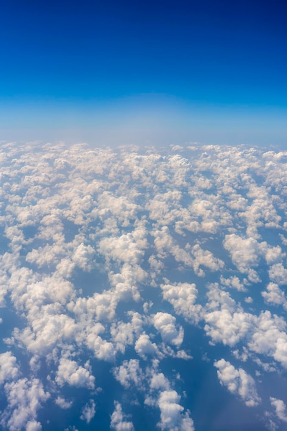 White clouds and blue sky a view from airplane window