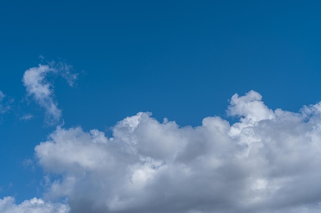 White clouds in the blue sky.