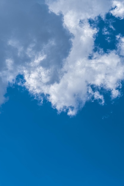 White clouds in the blue sky.