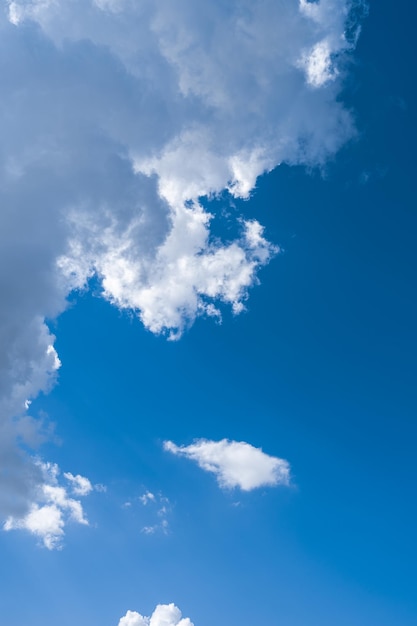 White clouds in the blue sky.