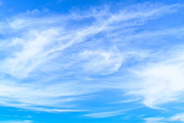 White clouds in a bright blue sky. The beauty of the nature.