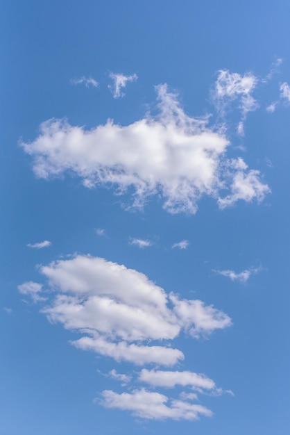 White clouds cumulus clouds floating on blue sky for background concept