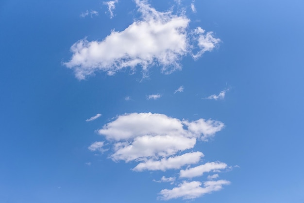 White clouds cumulus clouds floating on blue sky for background concept