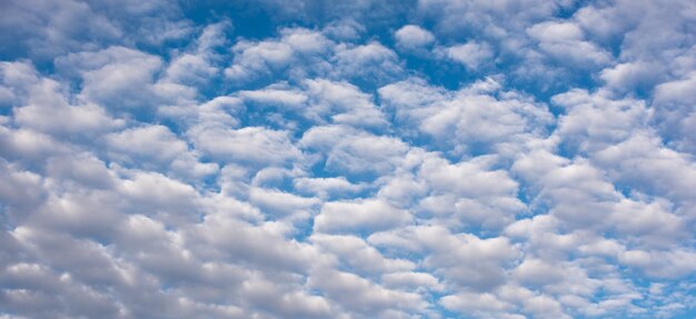 White color clouds found in the blue sky background