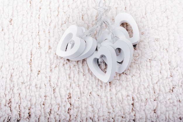 White color wooden hearts as a love background