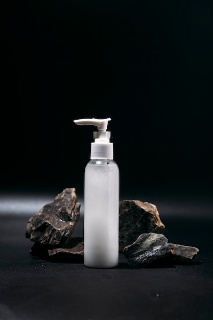 white cosmetic bottle on a dark background