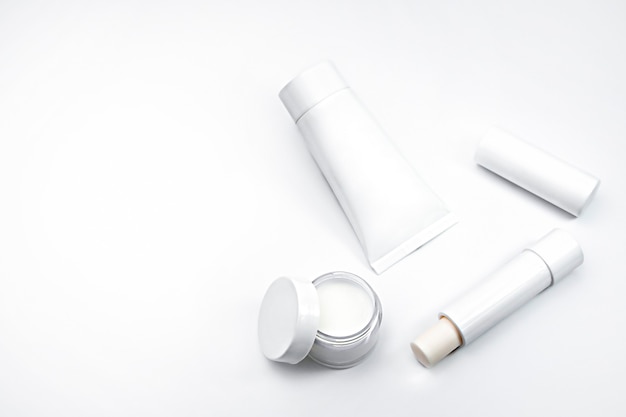 white cosmetics on light background