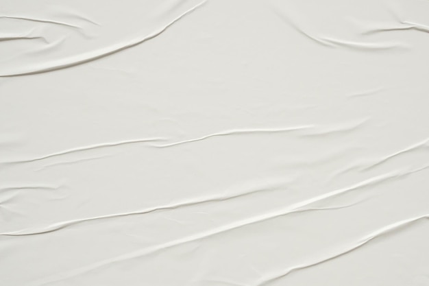 White crumpled and creased paper poster texture background