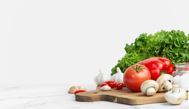 White culinary background with ingredients for making salad