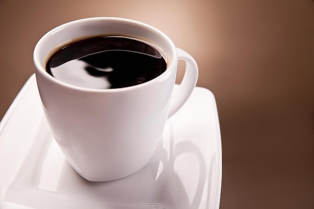 White Cup of coffee on a beautiful brown background