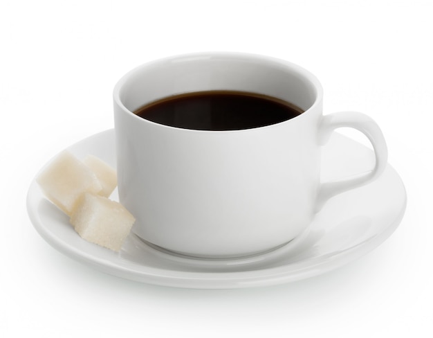 White cup of coffee with sugar pieces