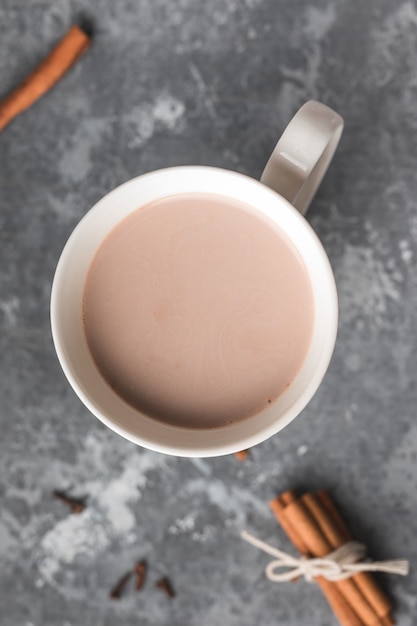 A white cup of hot cocoa on table