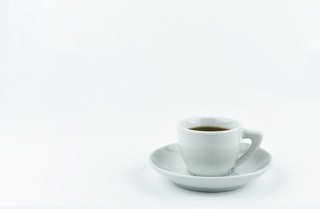 White Cup on a saucer with coffee