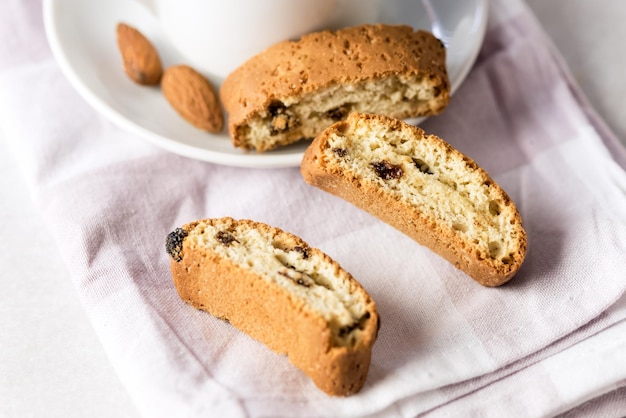 White Cup of Strong Coffee Served with Italian Almond Cookies Cantucci Gray Background