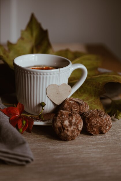 White cup of tea autumn still life