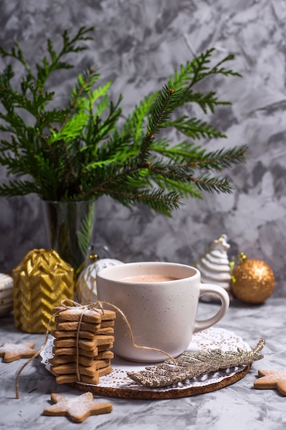 A white cup with hot cocoa with marshmallow