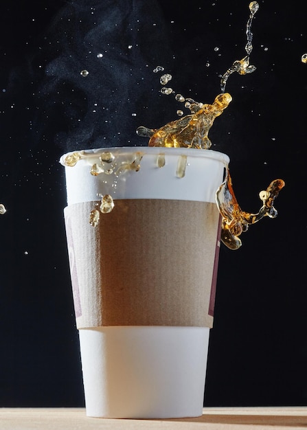 White cup with a splash of coffee.