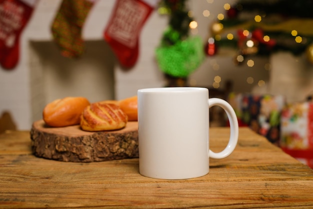 White cup on wooden table Mug and breads on table with christmas background