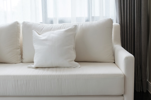 White decorative pillows on a casual sofa in the living room