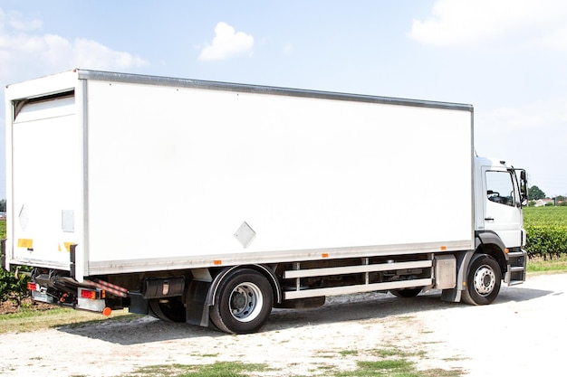 White delivery panel truck van for transport with blank for logo or trademark