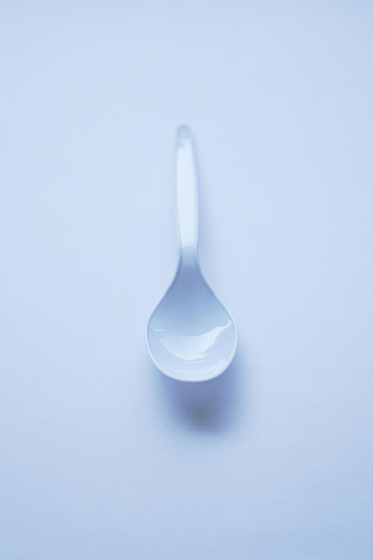 White disposable plastic spoon used for eating