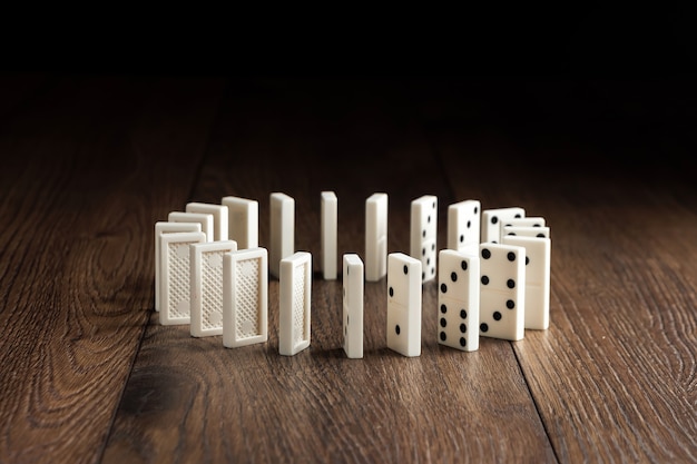 white domino on brown wood