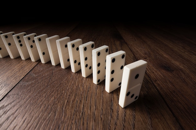 white domino on brown wood