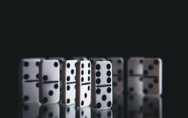 White dominoes in the dark close up