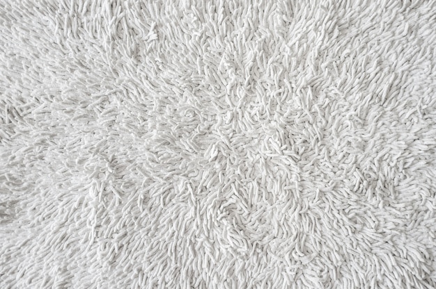 White doormat carpet texture background. Concept of house cleaning and hygiene