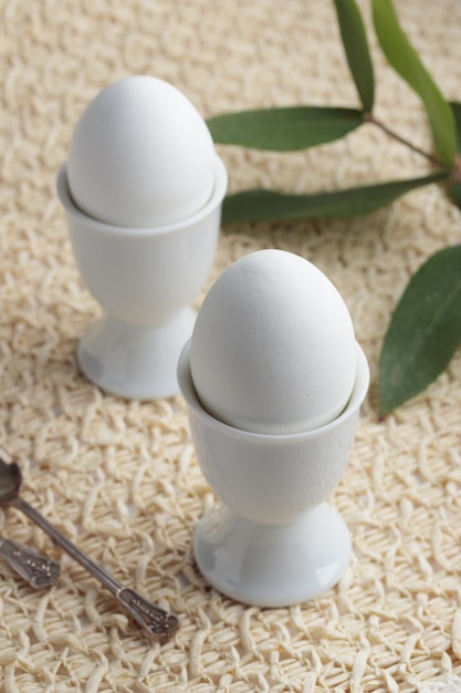 White egg on white eggstand holder