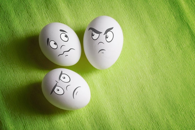 White eggs with comical emotional faces