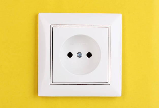 White electric socket on the wall