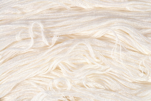 White embroidery floss as background texture