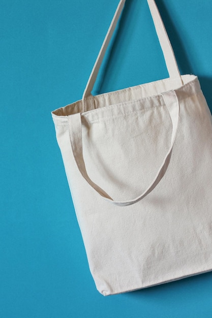 White fabric bag without a pattern on a blue background eco bag