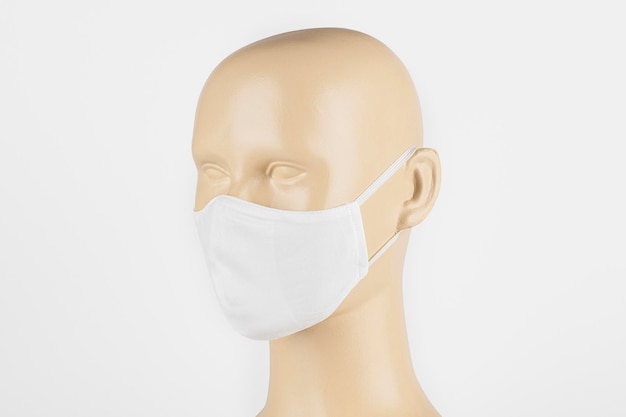 White fabric face mask on a mannequin