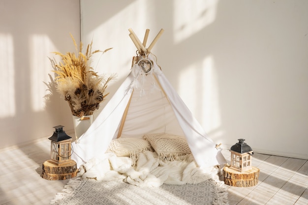 White fabric wigwam and Native American decor in the interior of the children's room.