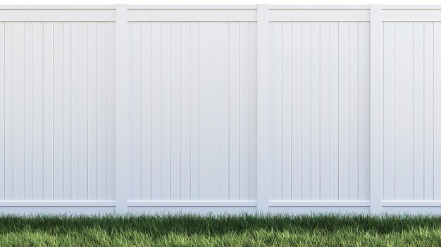 A white fence with a green grassy area in front of it