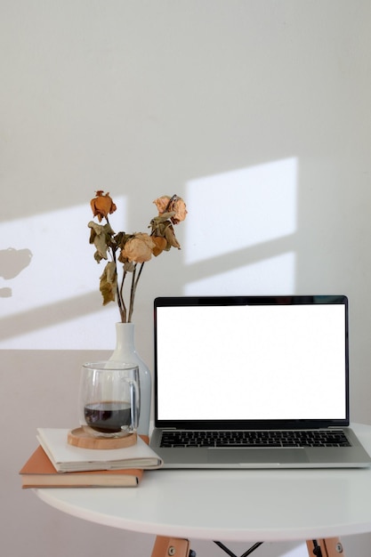 White flower vase on table at home