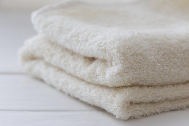 White fluffy bath towels on the white background