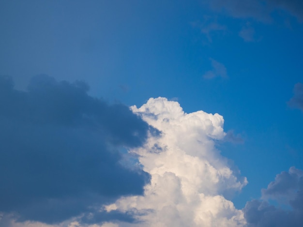 White fluffy clouds in blue sky for background