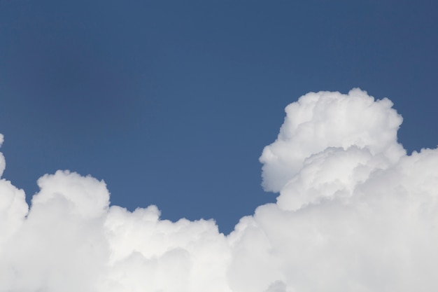 White fluffy clouds in the blue sky