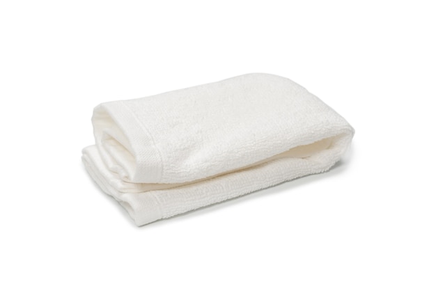 White fluffy cotton towel isolated on a white surface. Spa and resort.