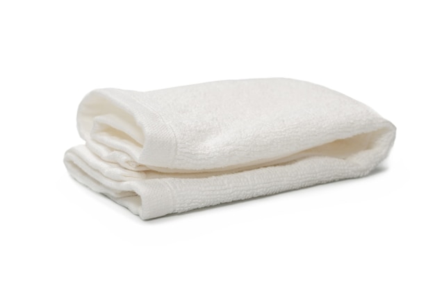 White fluffy cotton towel isolated on a white surface. Spa and resort.