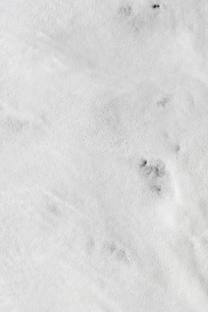 White foam bottom waves reaching shore overhead view