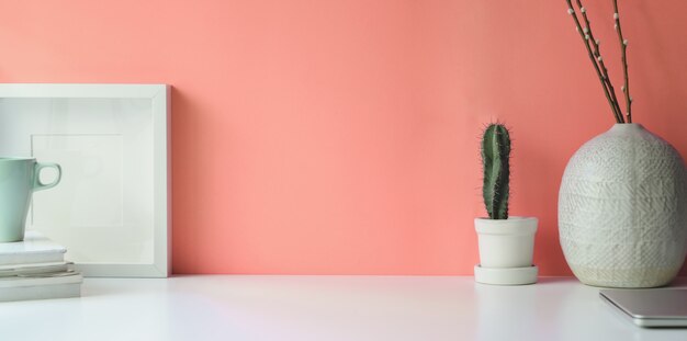 White frame on white desk workspace 