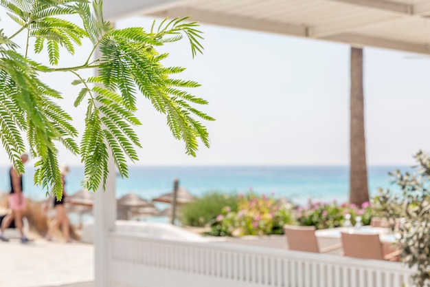 White gazebo for relaxing on the background of the sea in the resort. Tourism and travel.